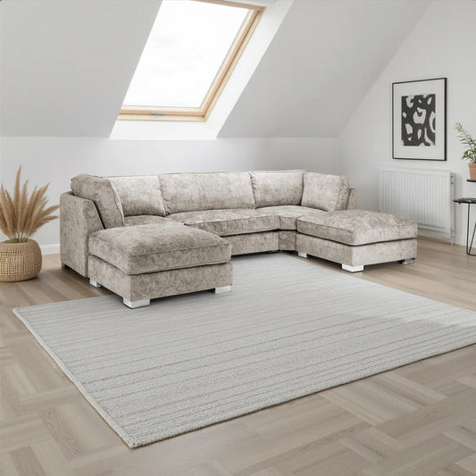 Sectional sofa in a living room with a skylight and decorative elements.