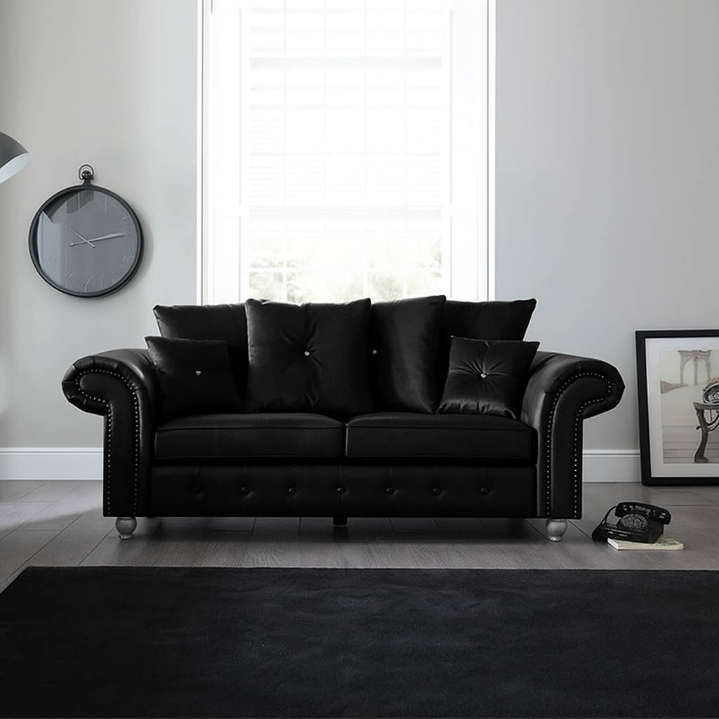 Elegant Leather Ashwin 3-Seater Sofa in Black — Modern Chesterfield design with button detailing and plush cushions in a bright living room