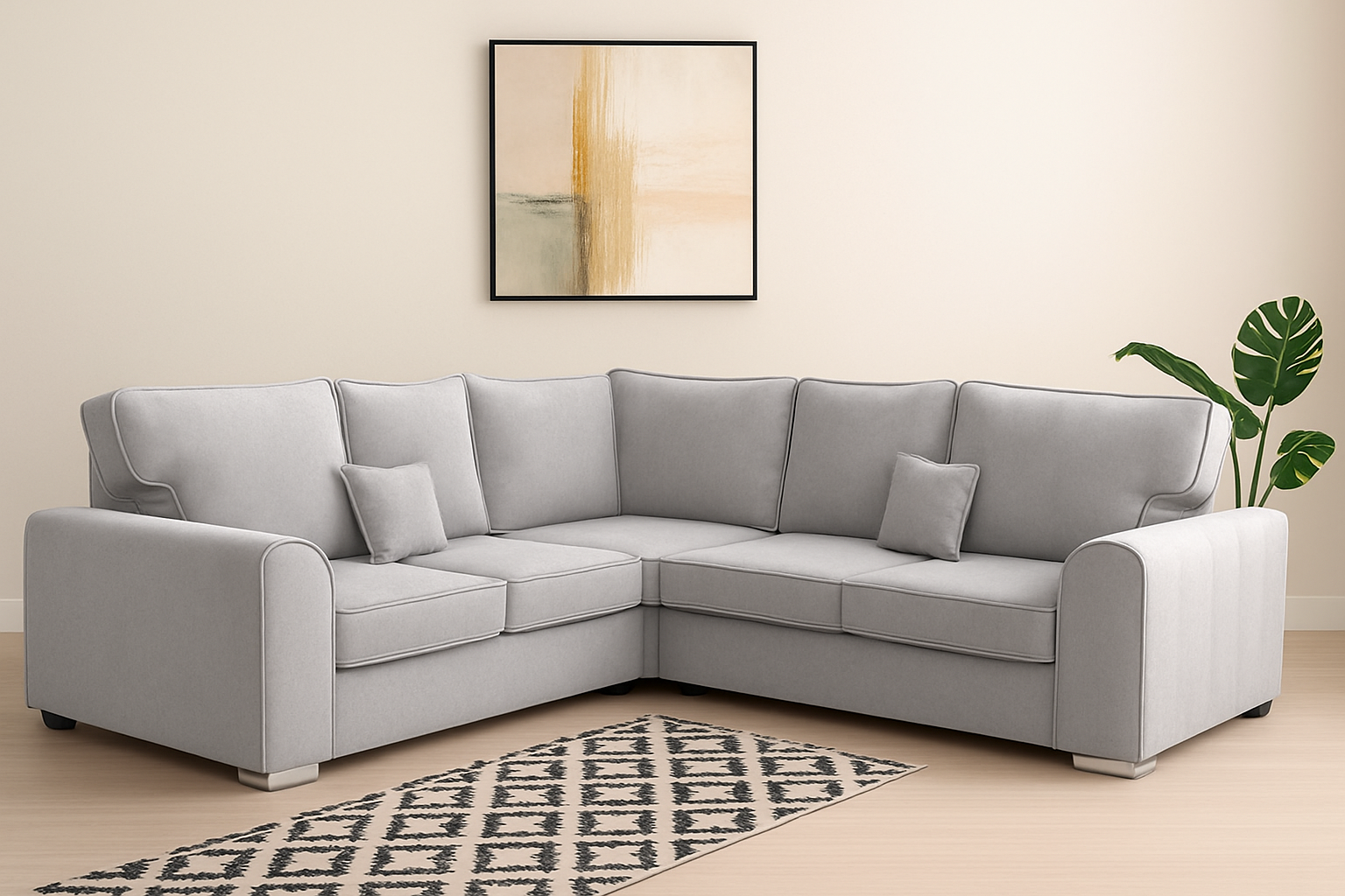 Gray sectional sofa in a living room with a patterned rug and abstract painting.