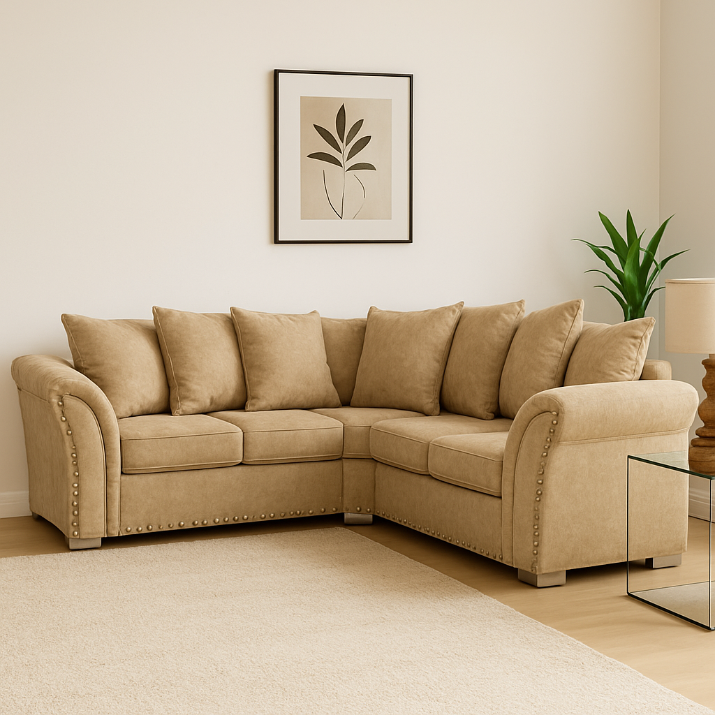 Beige sectional sofa in a living room with a plant and framed picture on the wall.